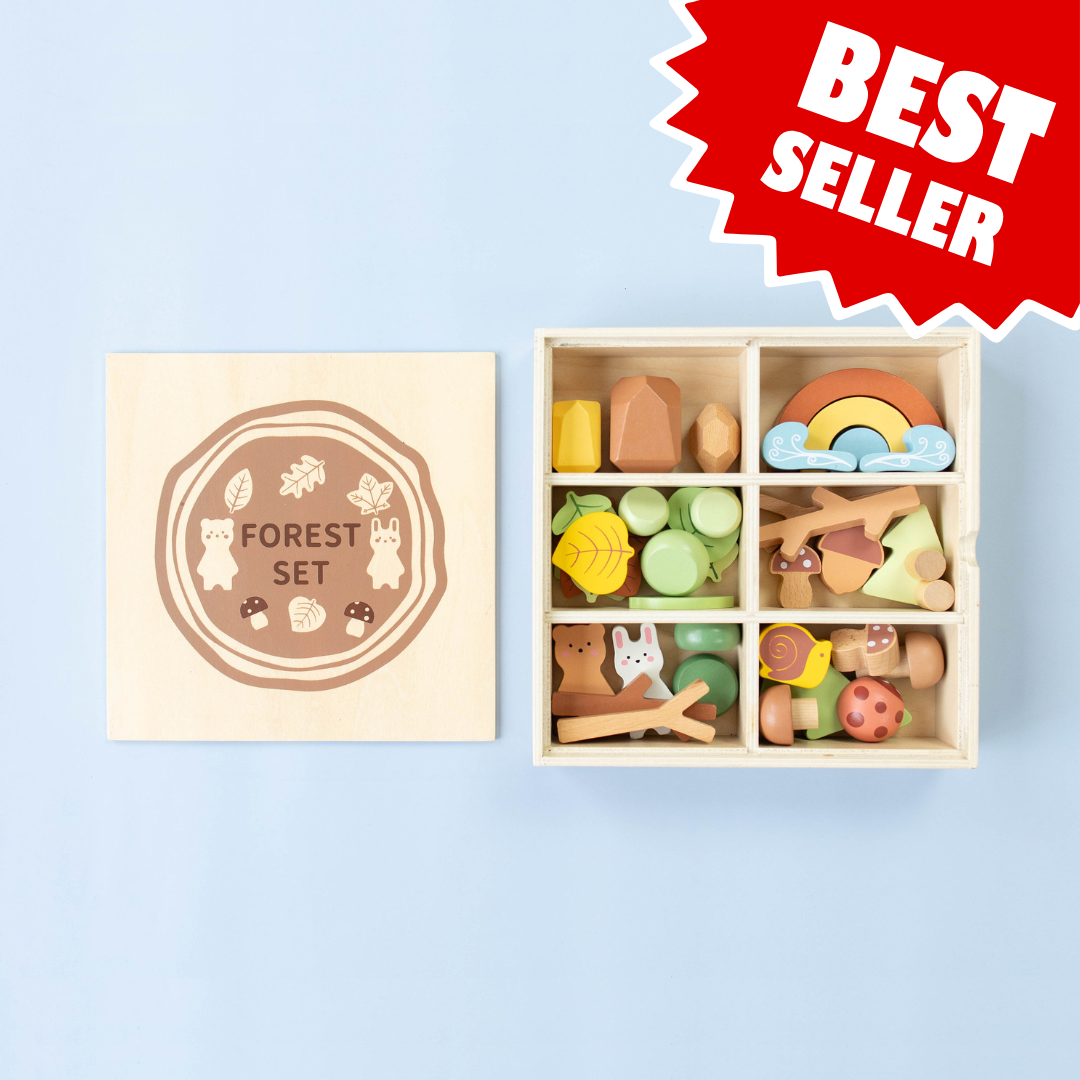 Wooden forest sensory bin with open lid and colorful animal-themed wooden pieces