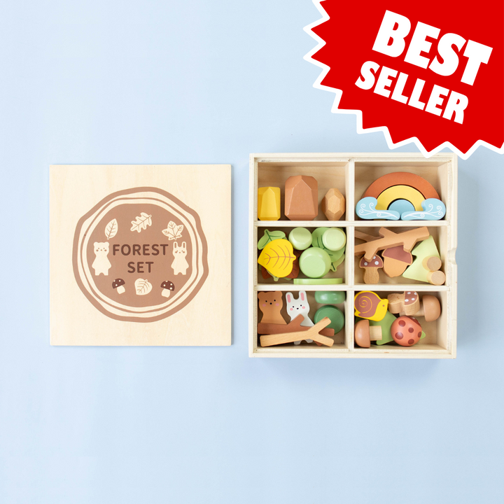Wooden forest sensory bin with open lid and colorful animal-themed wooden pieces