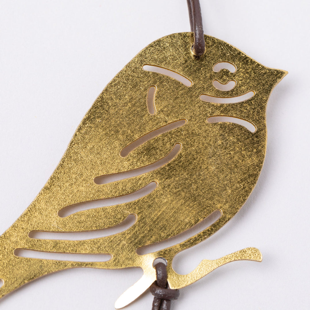 Gold-tone heart iron wind chime pendant with leaf cutout detail
