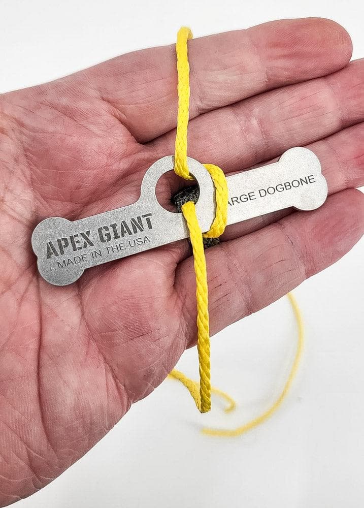 Large dogbone bag toggle with yellow cord hanging, APEX GIANT label visible