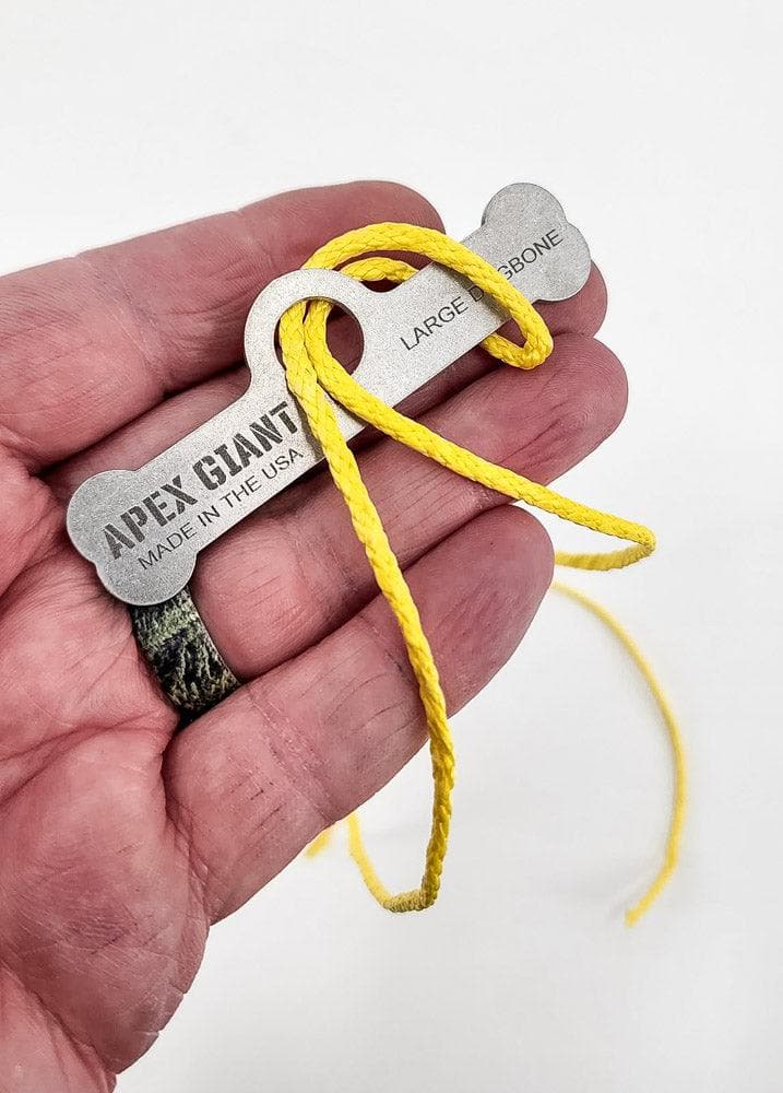 Large dogbone bag toggle with yellow cord, APEX GIANT text on metal plate