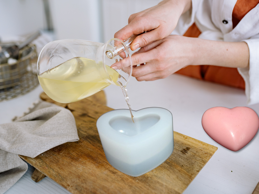 Heart-shaped wax freshener as oil pours onto the top, forming a shine