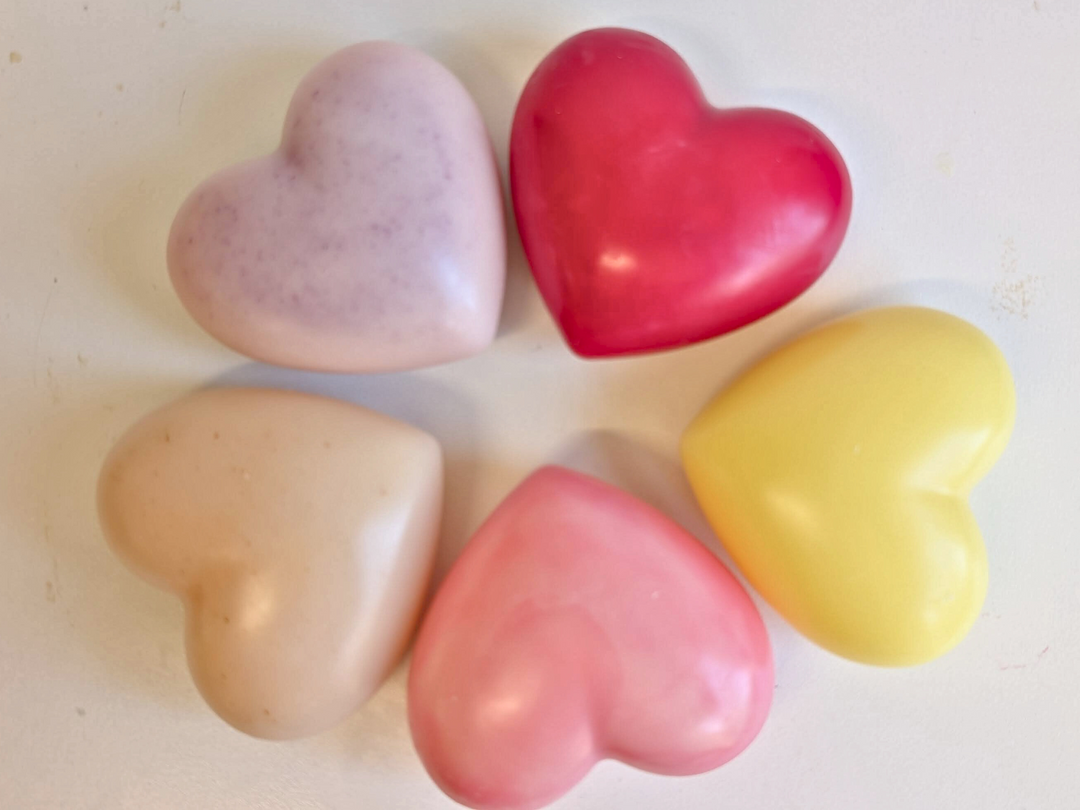 Assorted heart wax fresheners: lavender, red, cream, peach, and yellow