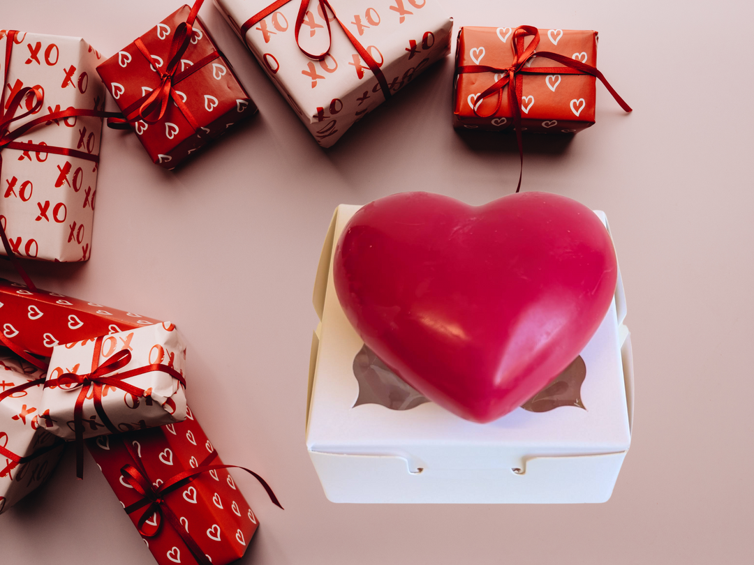 Red heart wax freshener in a white box with red ribbon gift wraps around