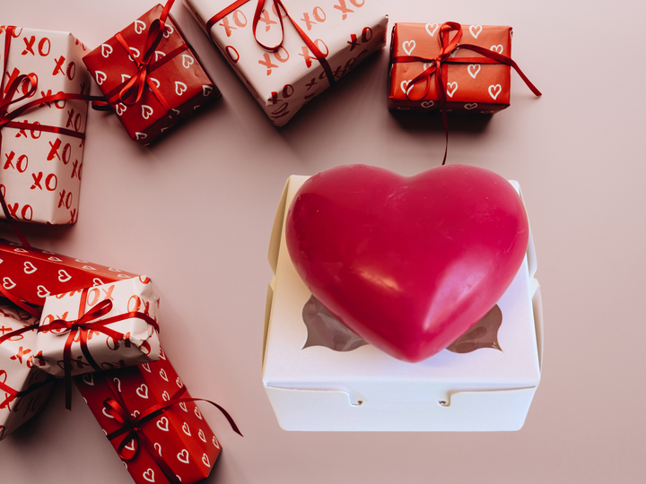 Red heart wax freshener in a white box with red ribbon gift wraps around