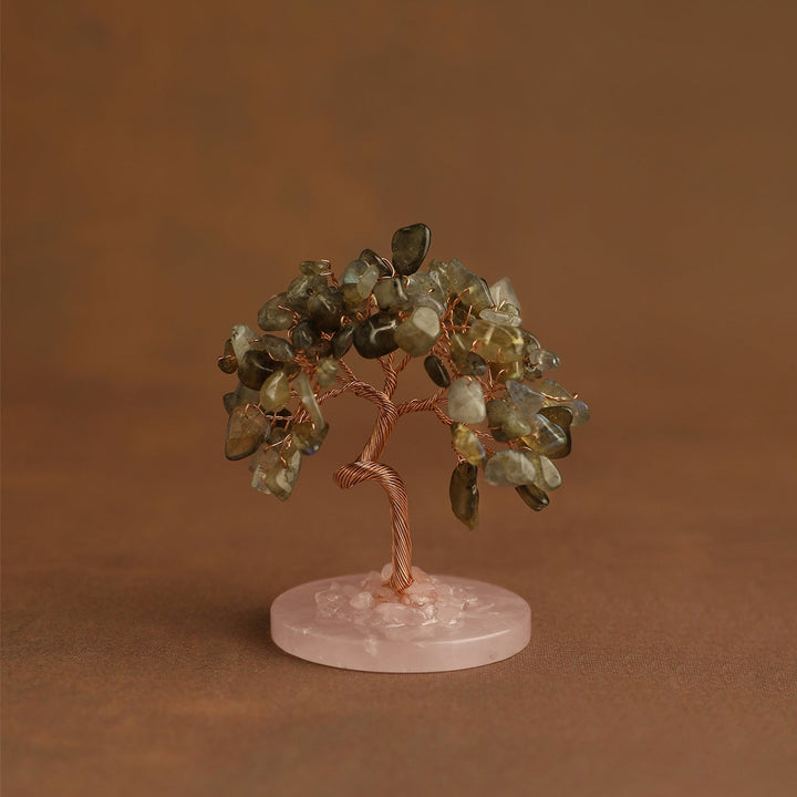 Mini crystal tree with smoky green-gray gemstones on pink stone base