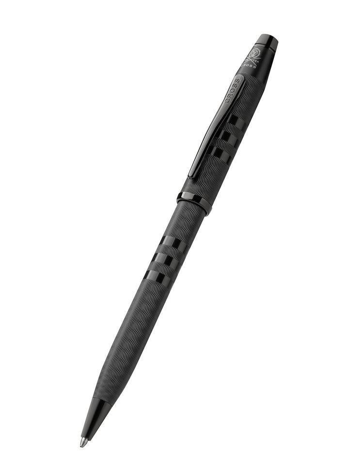 Dark black ballpoint pen with patterned barrel and pointed tip