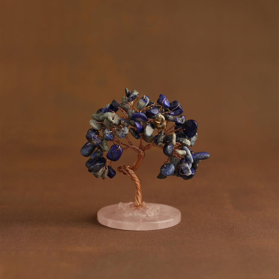 Crystal tree ornament with blue gemstone chips on pink round base