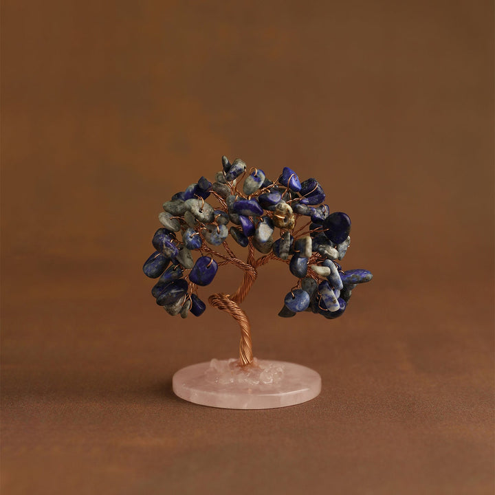 Crystal tree ornament with blue gemstone chips on pink round base