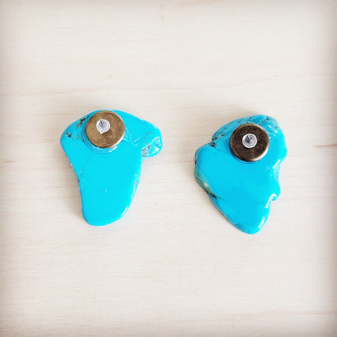 Turquoise slab earring studs shown from the back with round metal caps