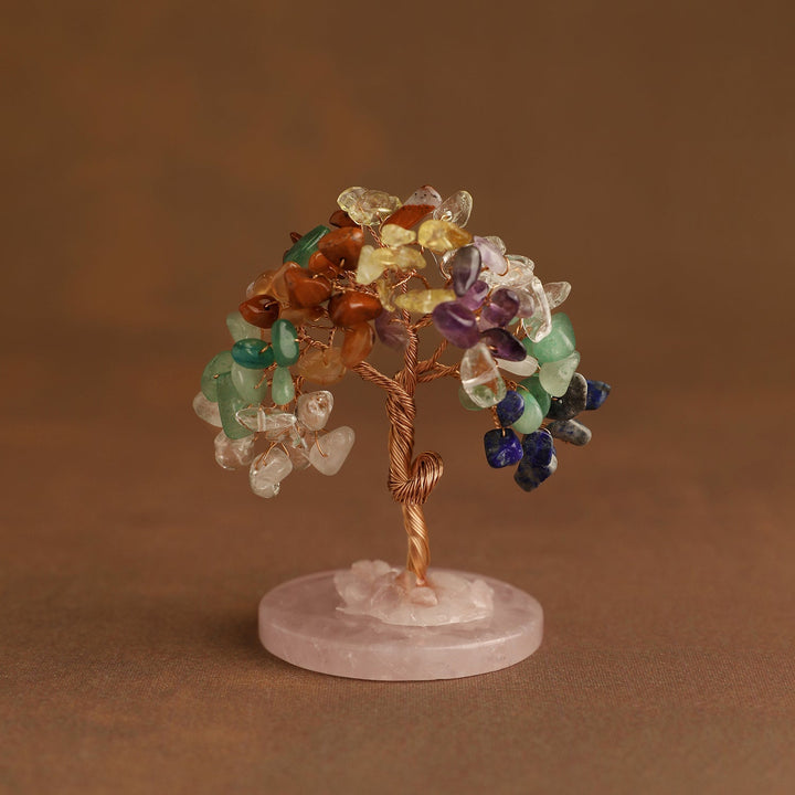 Mini crystal tree with multicolor gemstones on round pink stone base