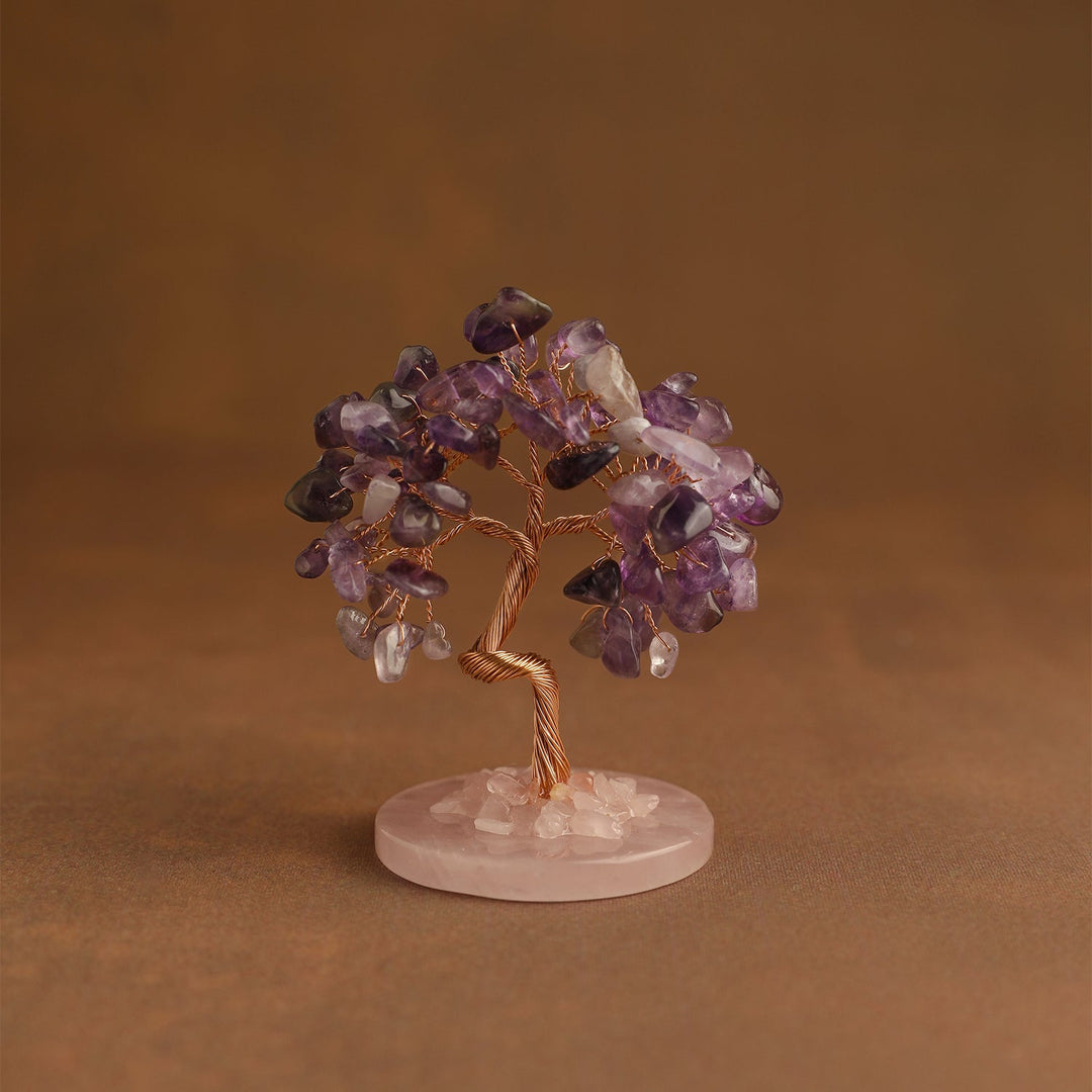 Crystal tree ornament with purple and clear gemstone chips on pink base