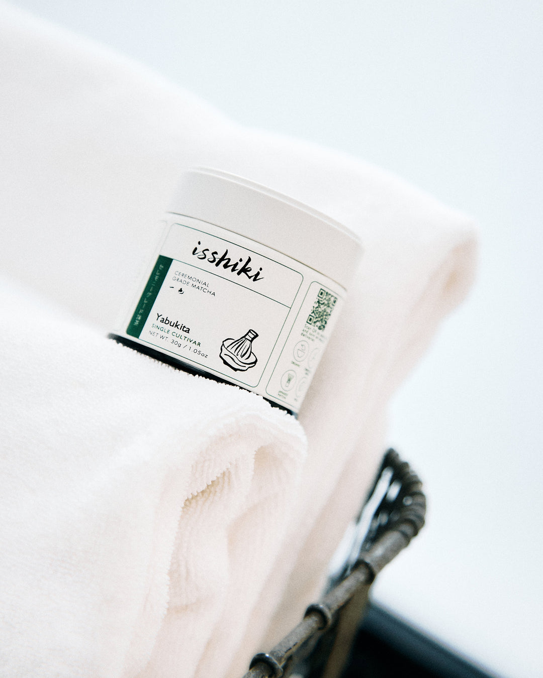 Ceremonial matcha tin resting on a white cloth