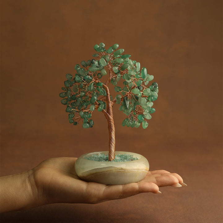 Green aventurine crystal tree with gold-toned wire trunk and round cream base