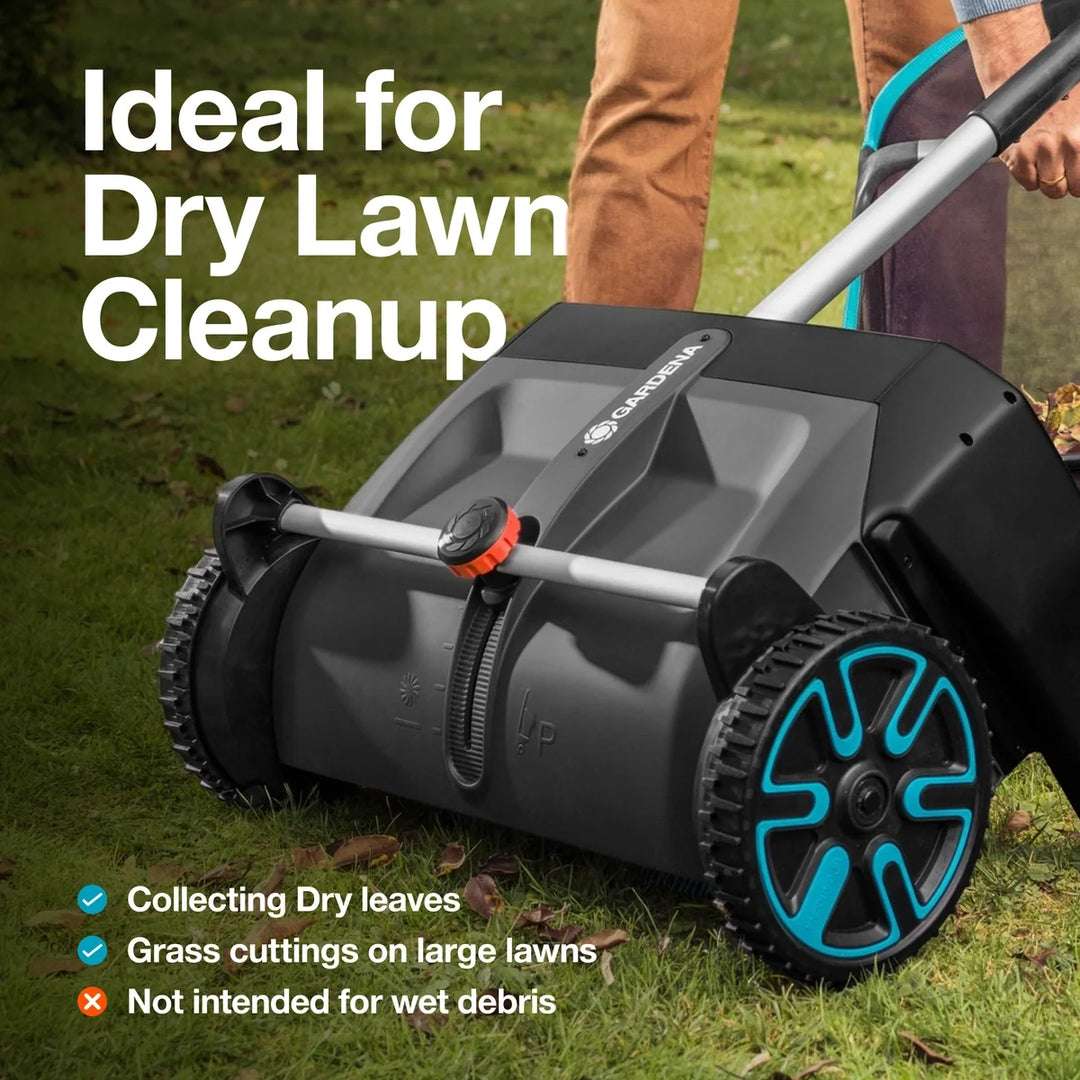 Leaf and lawn collector side view with gray brush housing, black hopper, teal wheel rims