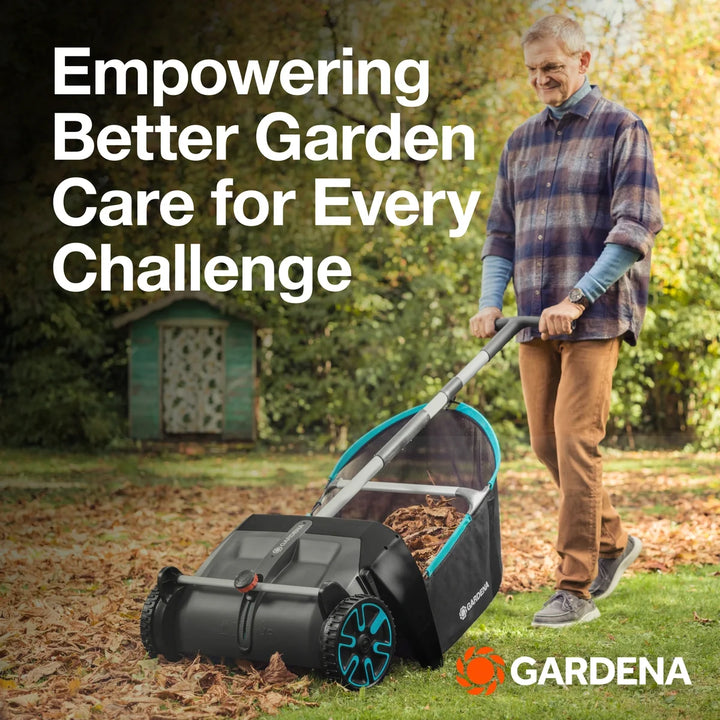 Leaf and lawn collector with black hopper bag, teal frame, and gray push handle