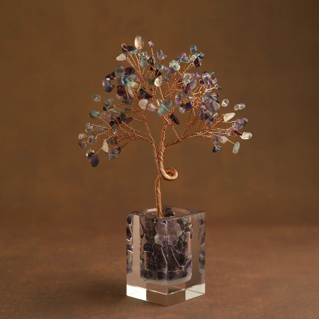 Multicolor gemstone crystal tree ornament with purple and green leaves in clear cube base