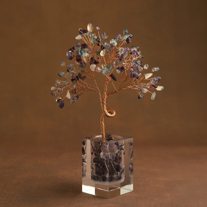 Multicolor gemstone crystal tree ornament with purple and green leaves in clear cube base