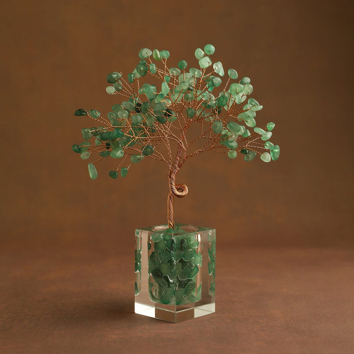 Green gemstone crystal tree ornament with leaf branches in clear cube base