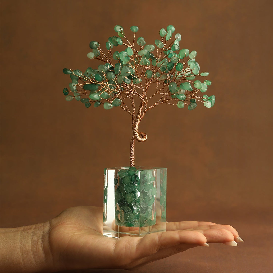 Green crystal tree ornament with wire branches and aventurine-style chips in a clear cube base