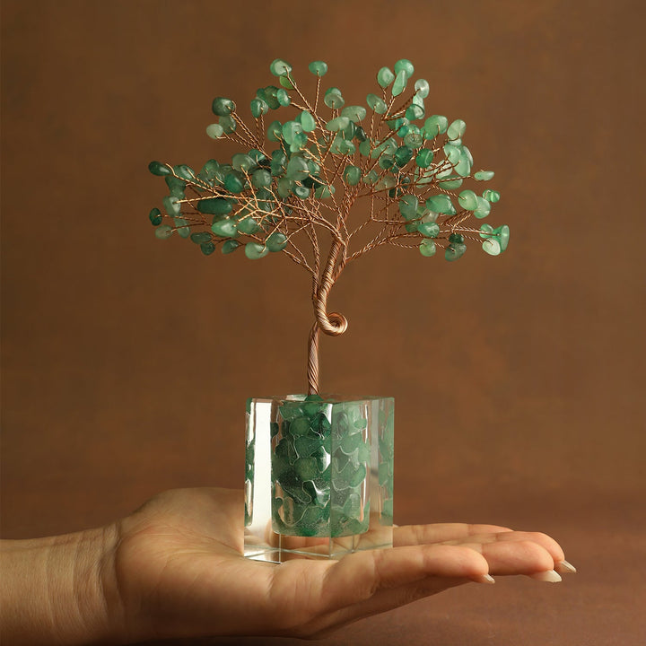 Green crystal tree ornament with wire branches and aventurine-style chips in a clear cube base