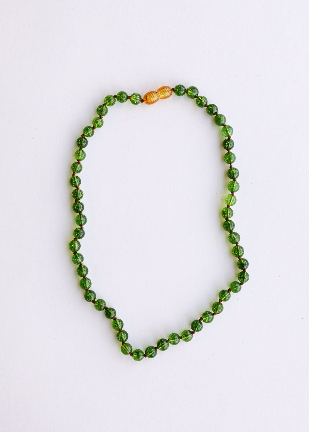 Peridot green gemstone beaded necklace with two amber/golden accent beads on top