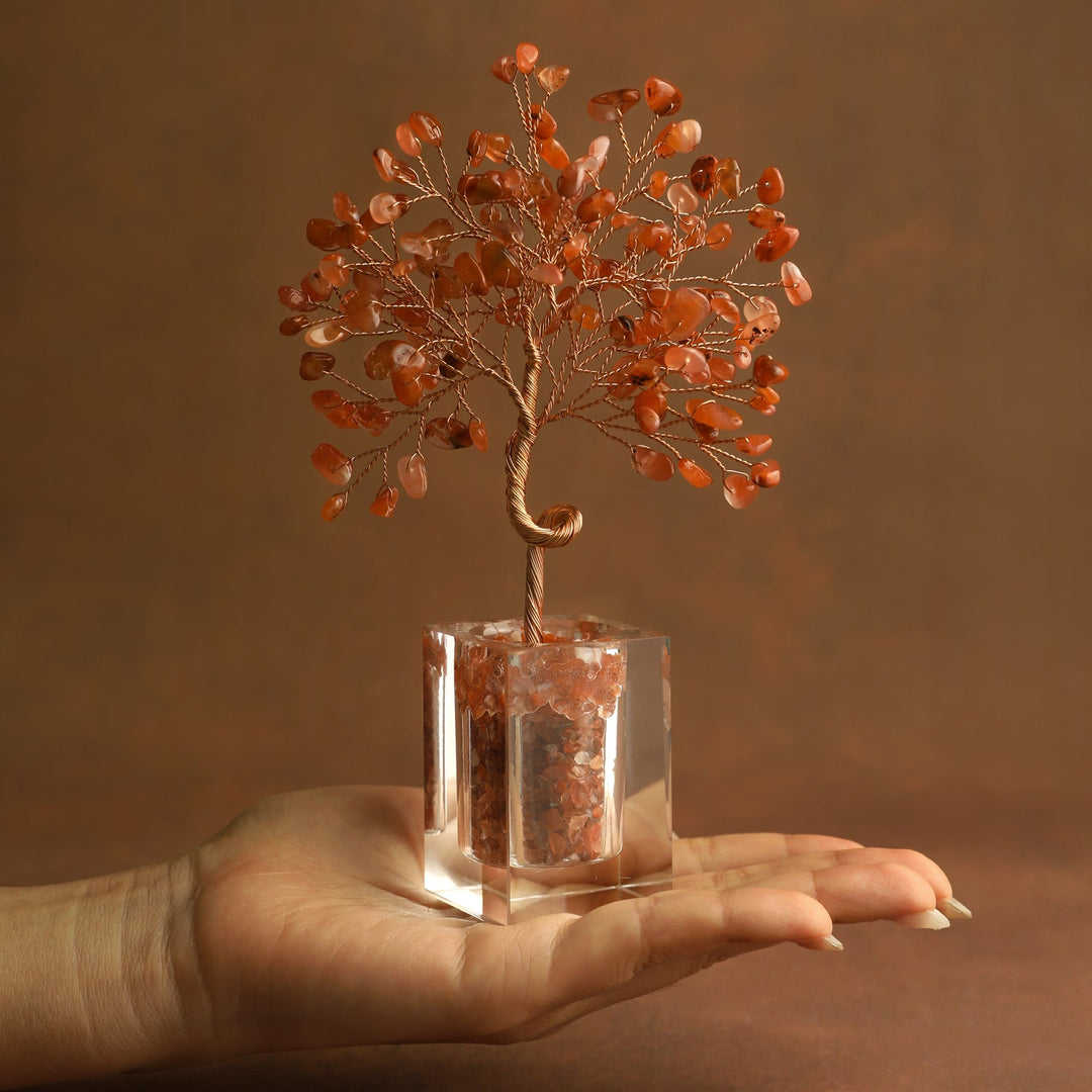 Orange crystal tree ornament with wire branches and carnelian-style chips in a clear cube base