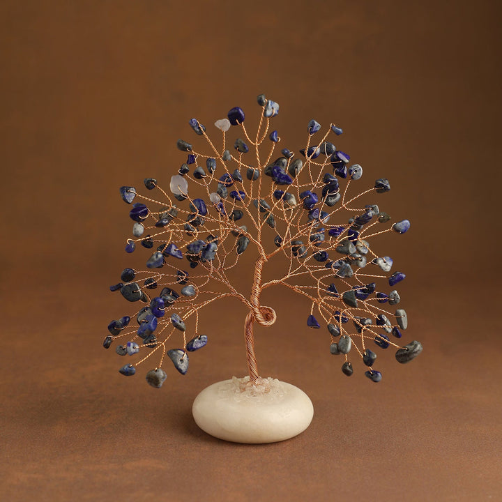 Dark blue crystal tree with gem leaves and a white jade stone base
