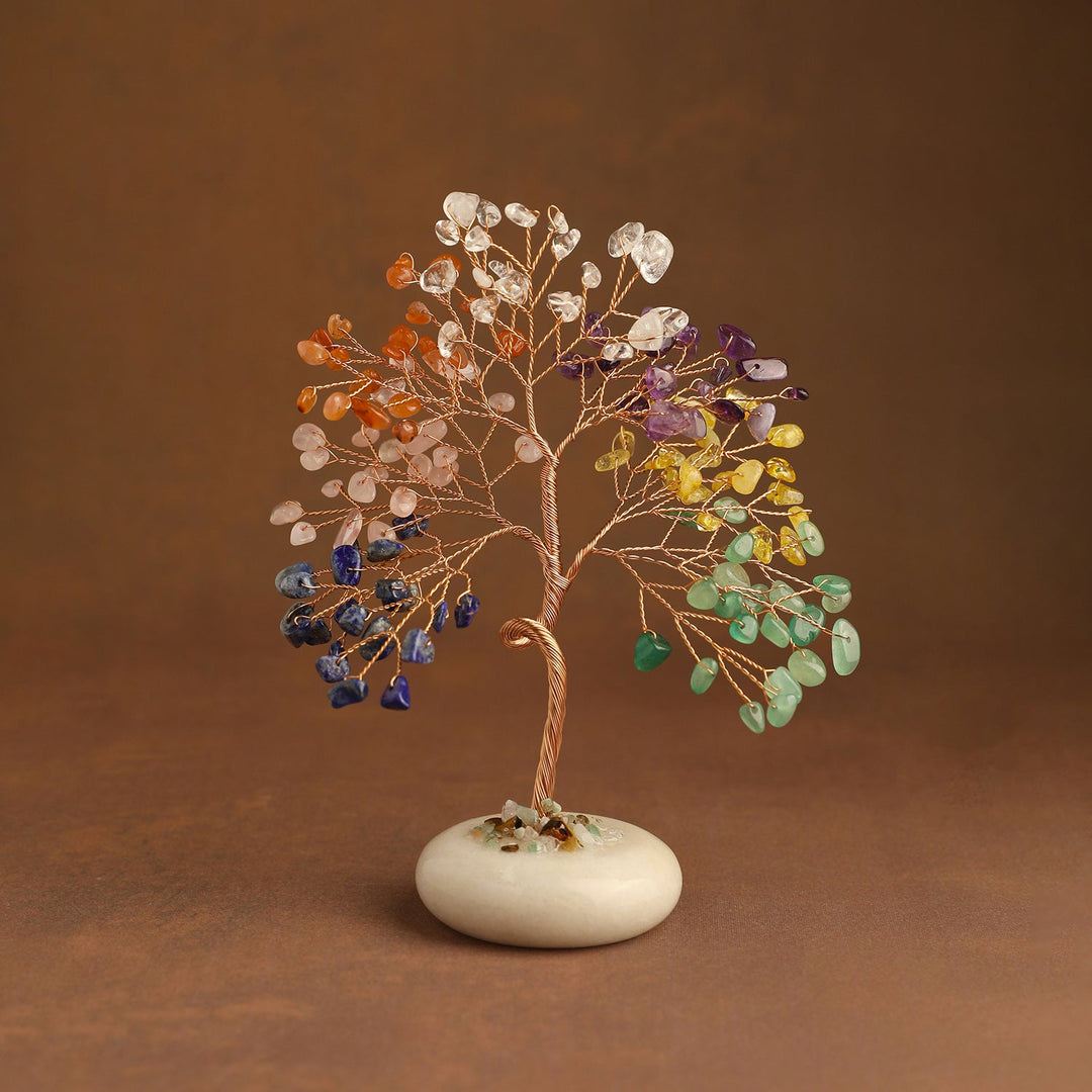 Colorful crystal tree with branch-wrapped trunk and white jade base