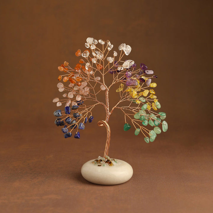 Colorful crystal tree with branch-wrapped trunk and white jade base
