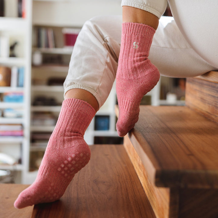 Coral non-slip socks on a person standing, showing full length and grip sole