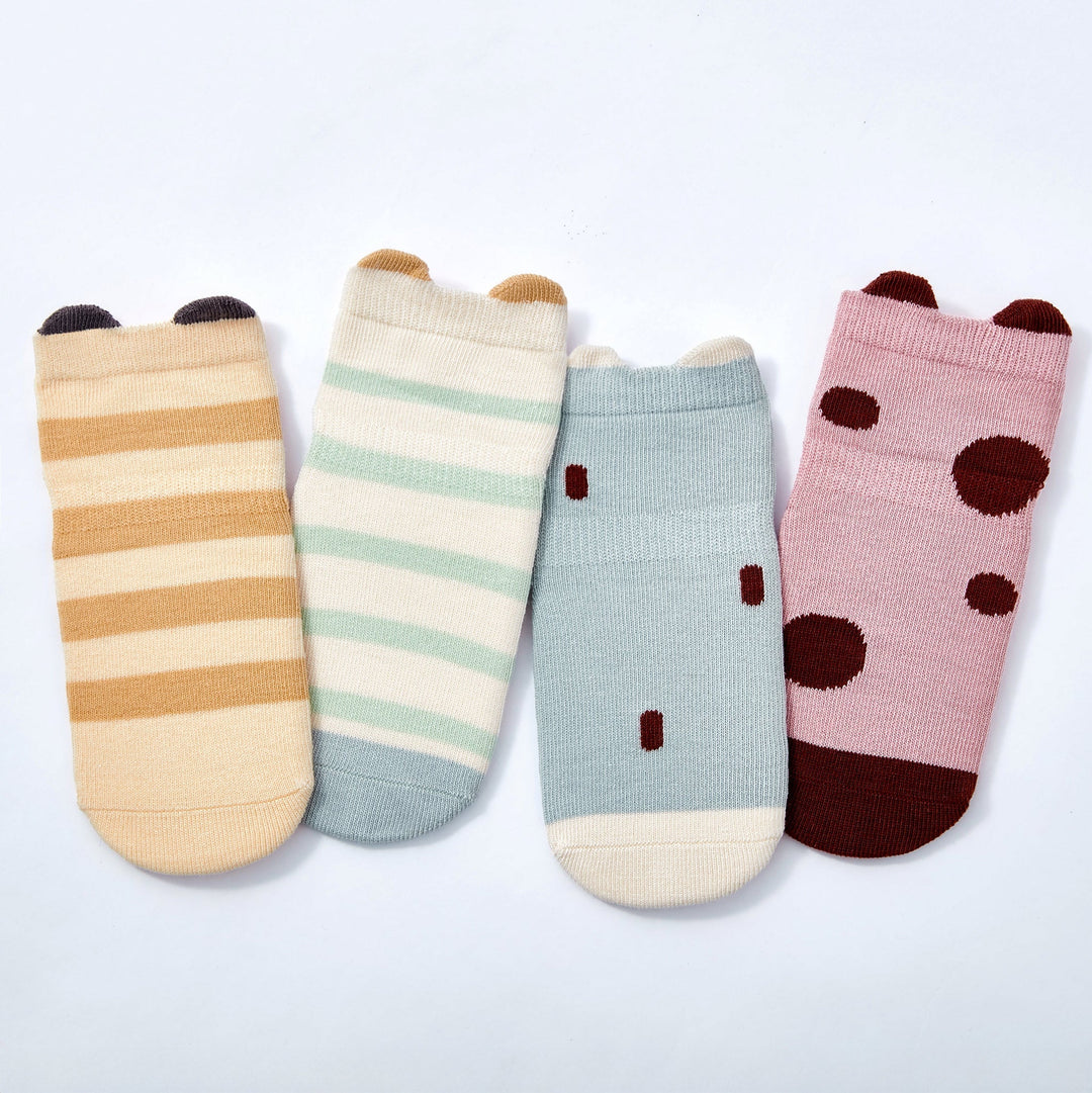 Baby non-slip socks set featuring light blue, cream stripe, pink dot, and ladybug designs