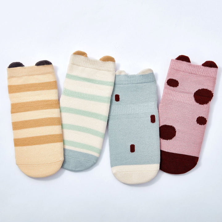 Baby non-slip socks set featuring light blue, cream stripe, pink dot, and ladybug designs