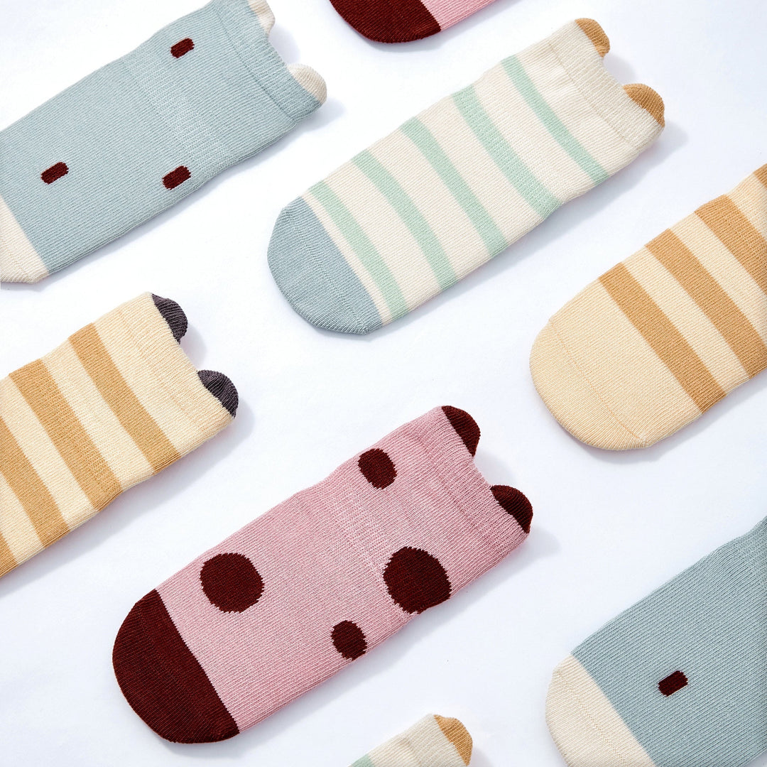 Baby non-slip socks assortment with striped, small-dot, and ladybug-graphic patterns