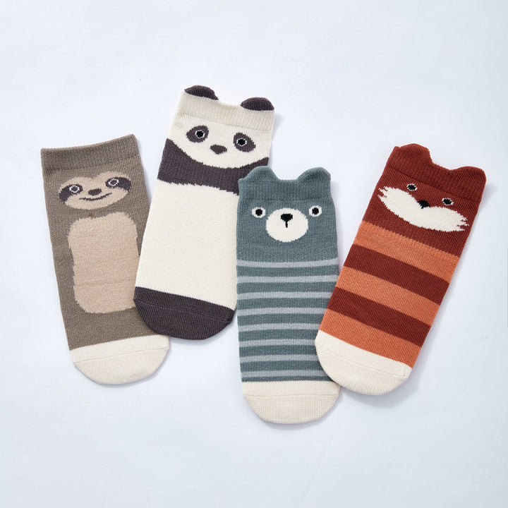 Four pairs of animal-face and striped non-slip crew socks in blue, gray, cream, rust