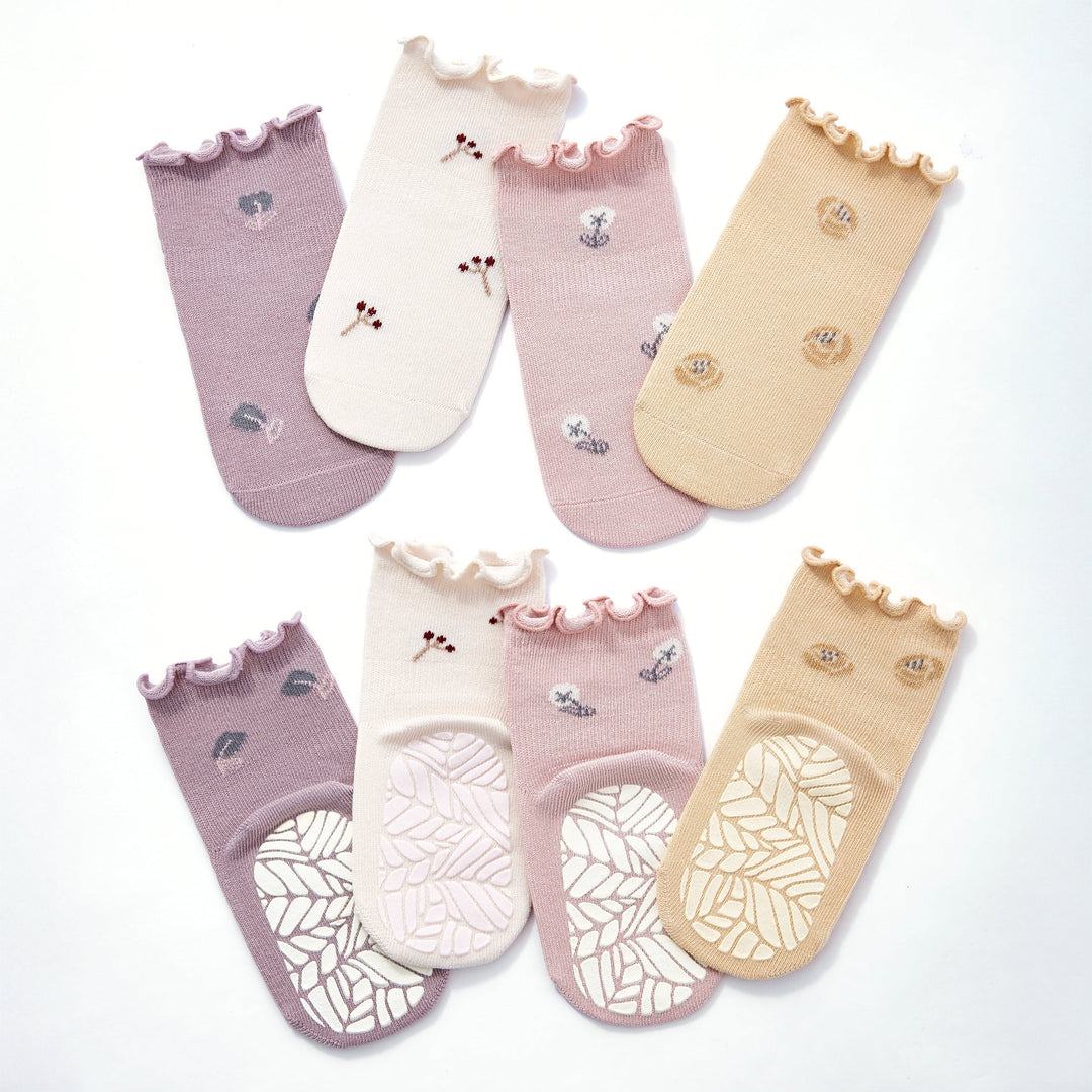 Baby non-slip socks set in lilac, cream, pale pink, and beige with gripped soles