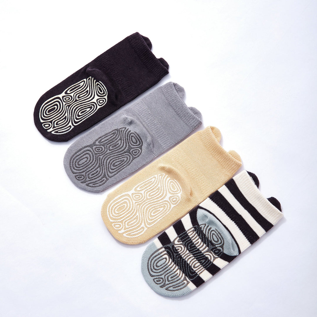 Cushioned baby non-slip socks with grippy soles in black, gray, and beige animal prints