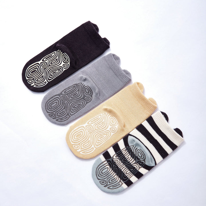 Cushioned baby non-slip socks with grippy soles in black, gray, and beige animal prints
