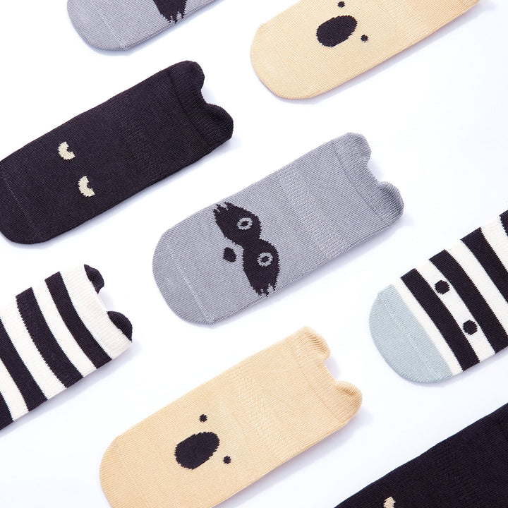 Assorted baby non-slip socks with polar bear-style faces, stripes, and grippy soles