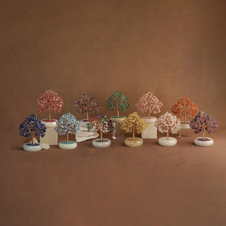 Set of multicolor crystal gemstone trees on small round white bases