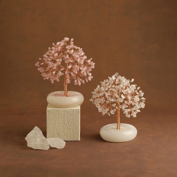 Two multicolor crystal gemstone trees with gold branches on white bases