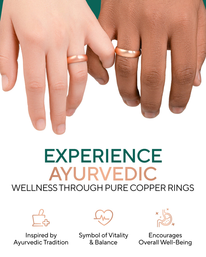 Copper domed rings on fingers, hands resting together