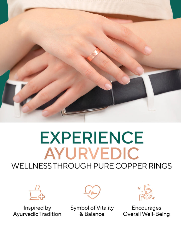 Copper hammered ring on hand over light fabric, close-up