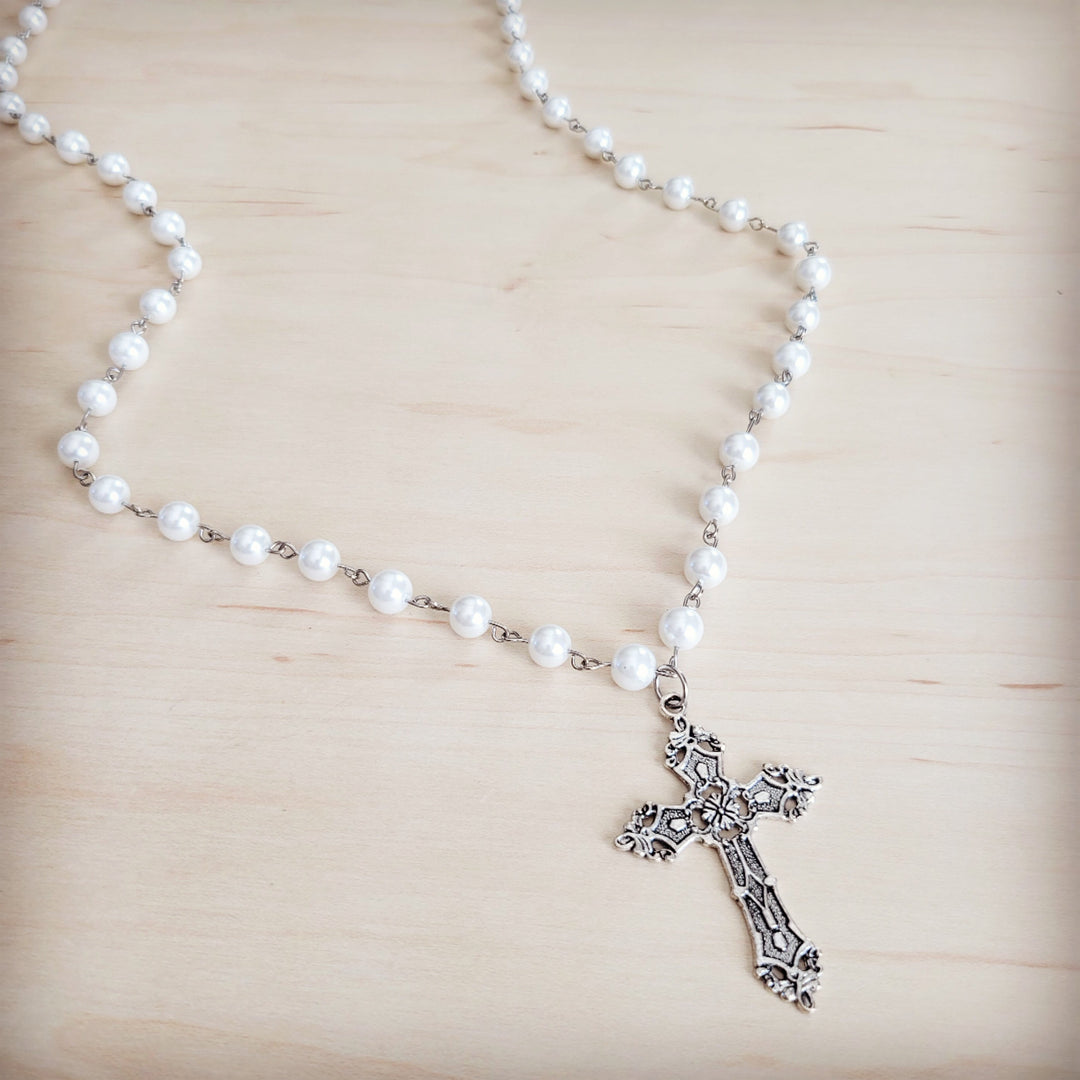 Long pearl beaded necklace with antique silver cross pendant