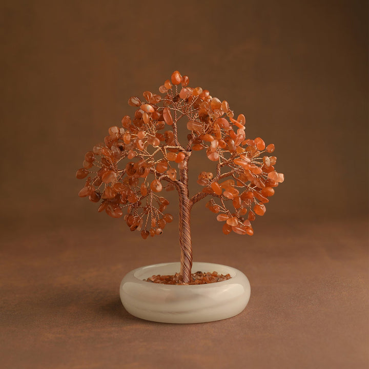 Orange crystal tree ornament with gold wire trunk and round stone base