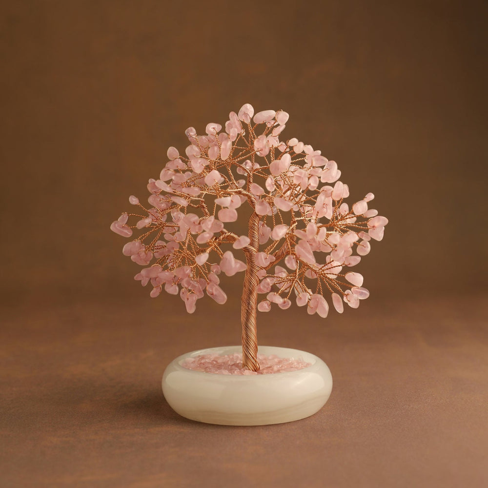 Pink crystal gemstone tree with gold branches and white oval base