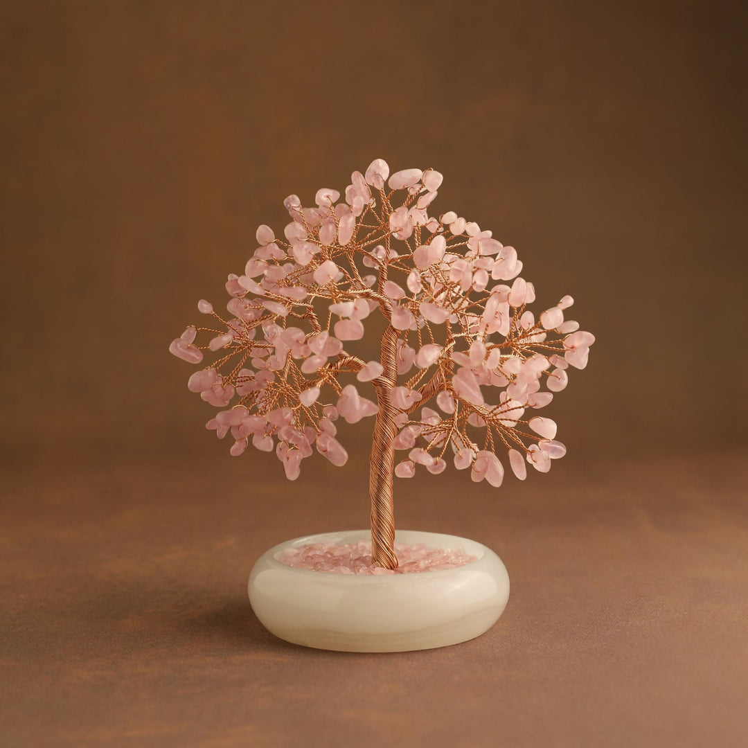 Pink crystal gemstone tree with gold branches and white oval base