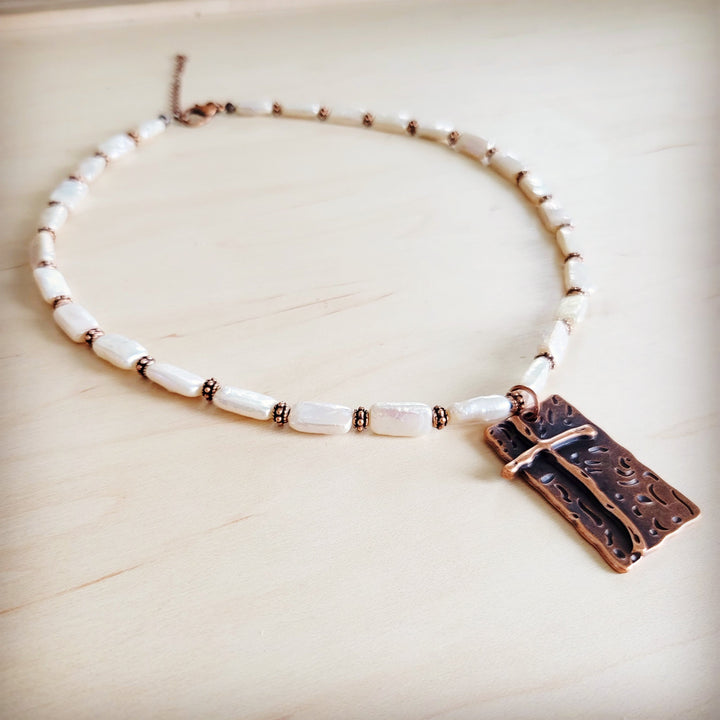 Freshwater pearl beaded necklace with copper-tone cross pendant and chain extender