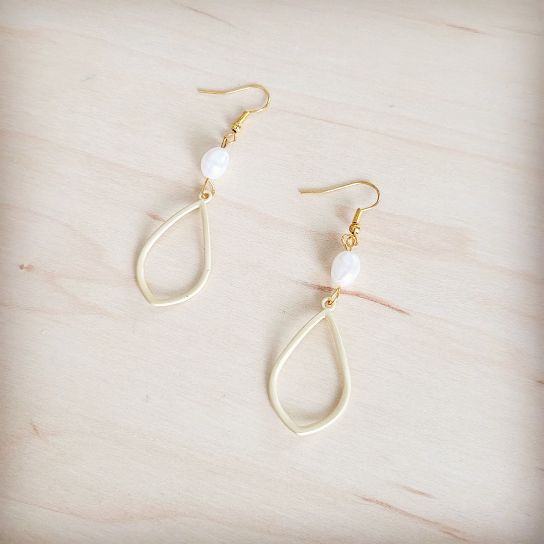 Gold teardrop earrings with white freshwater pearl and small gold bead accent