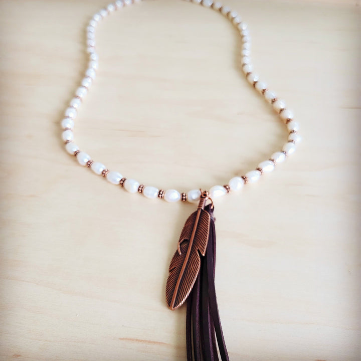 Pearl bead necklace with copper feather pendant and long tassel